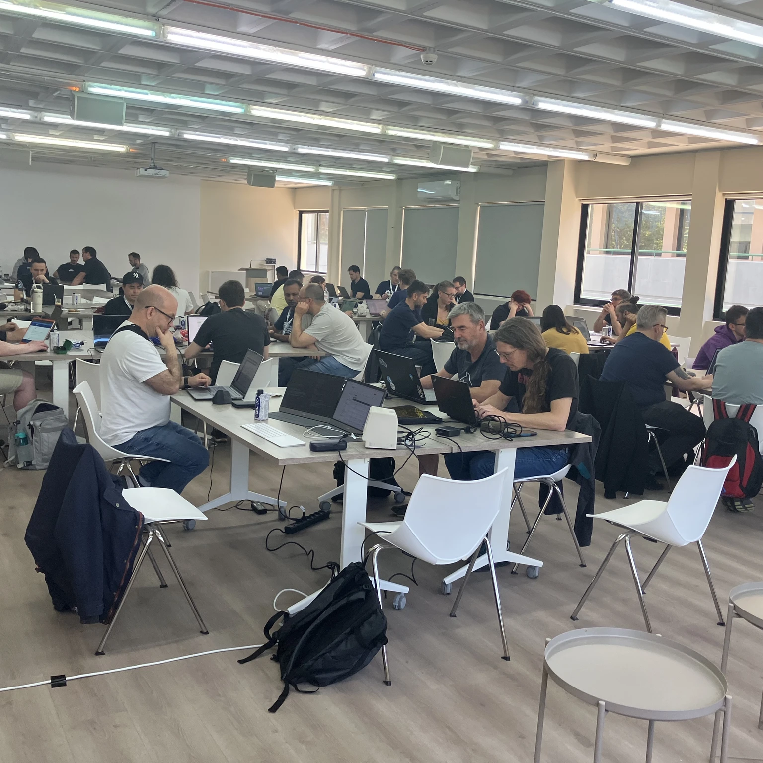 Drupal Dev Days Athens 2026 Contribution Day room with developers working at long tables
